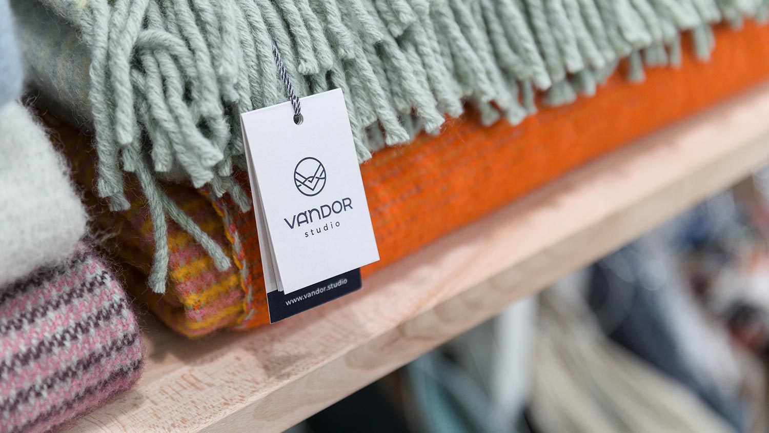 Vandor Studio's paper hangtag with details of wool blankets