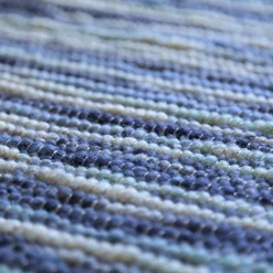 detail of blue wool rug with gradient colours