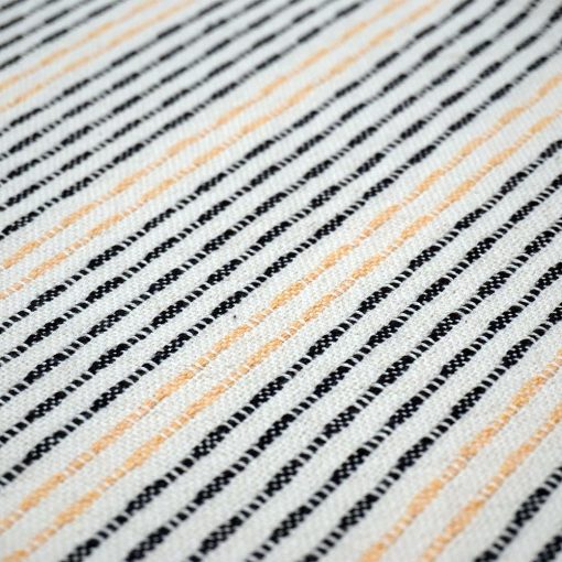 detail of a navy and peach striped cotton cushion